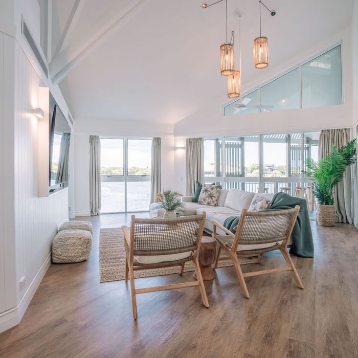 Novotel Sunshine Coast Resort Grand Overwater Bungalow living room with light coastal design and water views