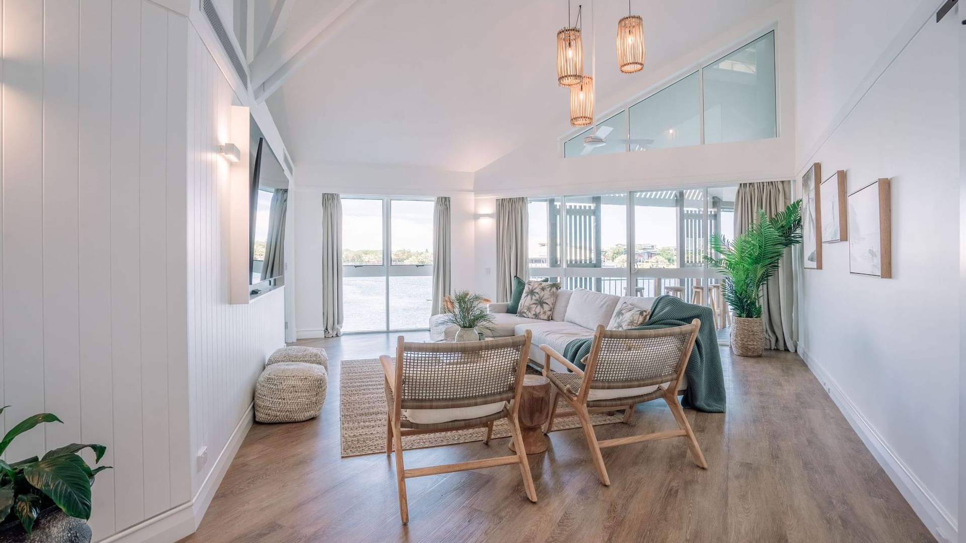 Novotel Sunshine Coast Resort Grand Overwater Bungalow living room with light coastal design and water views