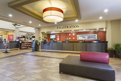 Interior of spacious lobby area & reception at Rosen Inn Lake Buena Vista