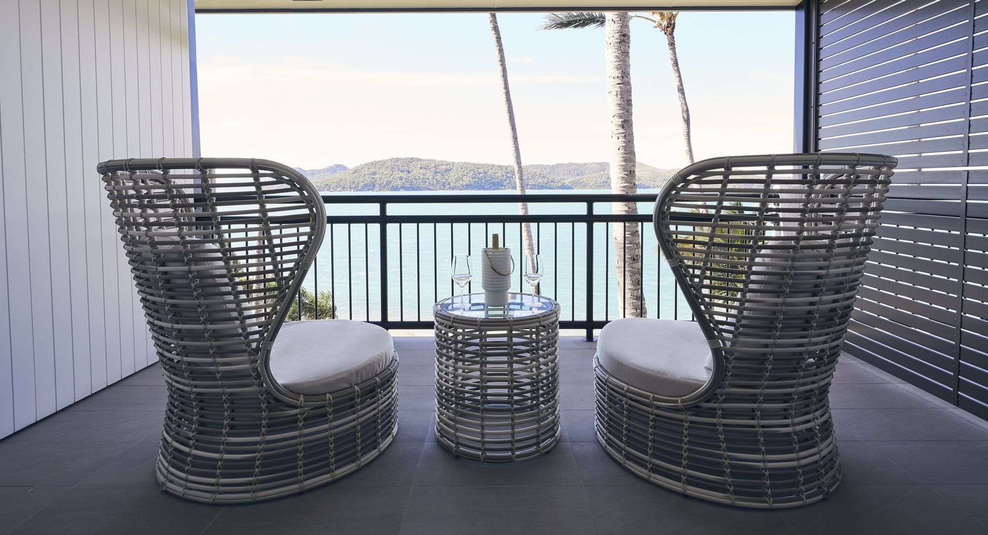 Comfy chair on terrace in deluxe room at Daydream Island Resort