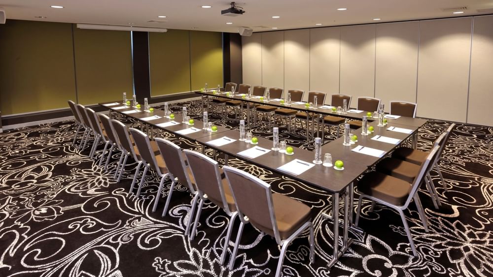 U-shaped table setup for a meeting at Novotel Melbourne