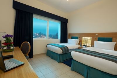 Two bed room suite with twin beds at Tamani Marina Hotel