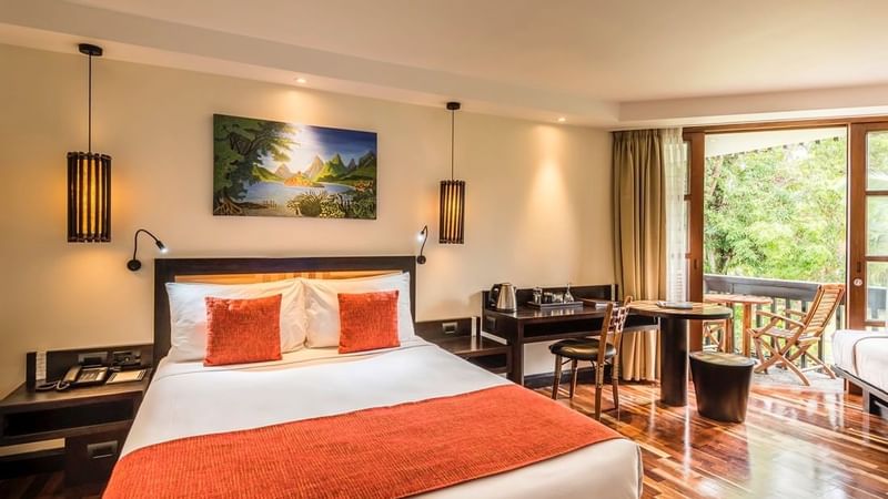 Bed & furniture in Superior Garden View room at Warwick Fiji