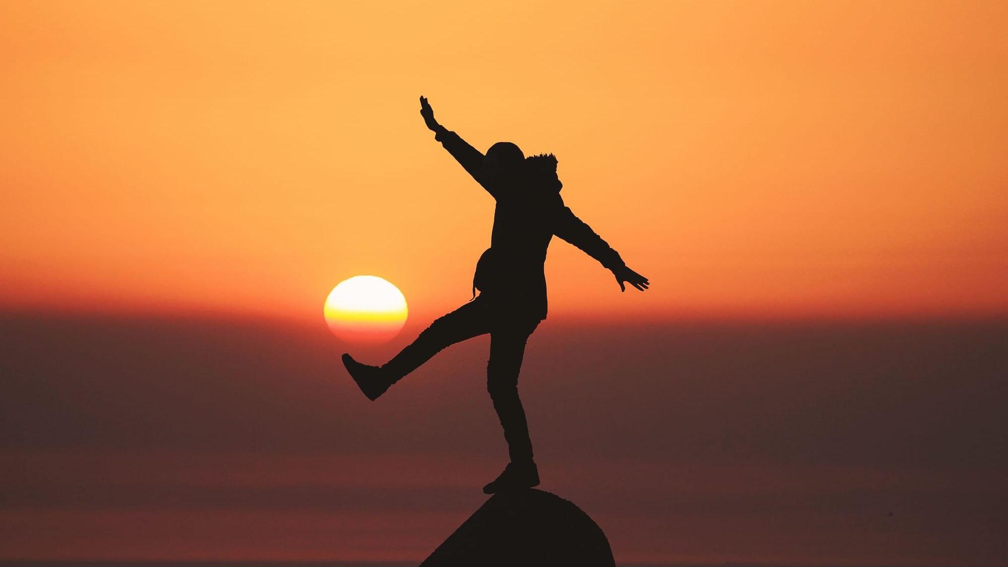 Man on a rock at sunset captured near Buena Vista Del Rincon