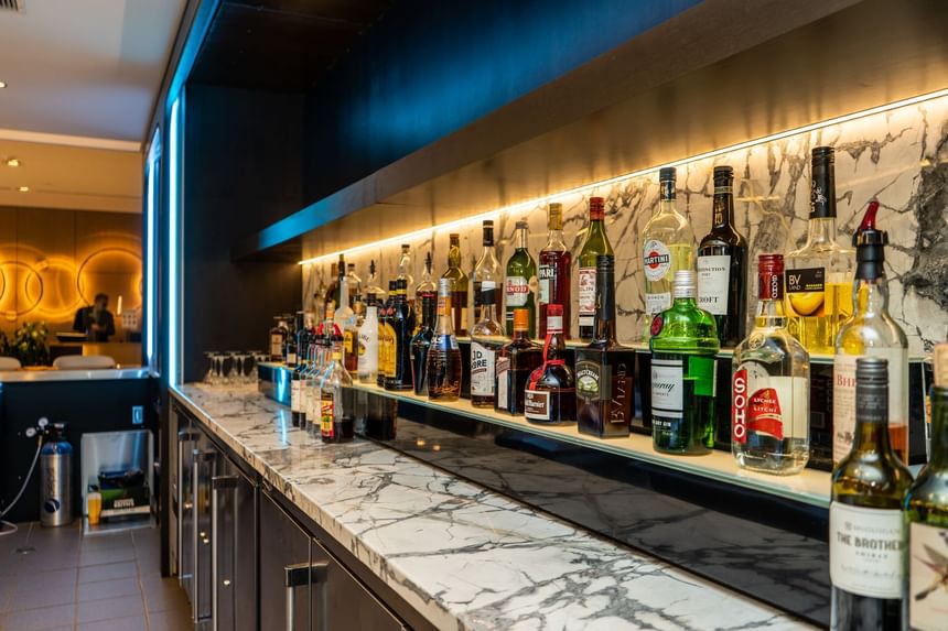 Shelves with various liquor bottles displayed at the Cannery Restaurant at the Atlantica Hotel Halifax