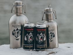 Closeup of beer cans on a table at Blackstone Mountain Lodge
