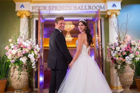 Couple by the wedding entrance at Safety Harbor Resort & Spa