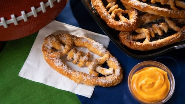 Bowl of dip, pretzels, and football for The Big Game Bash.