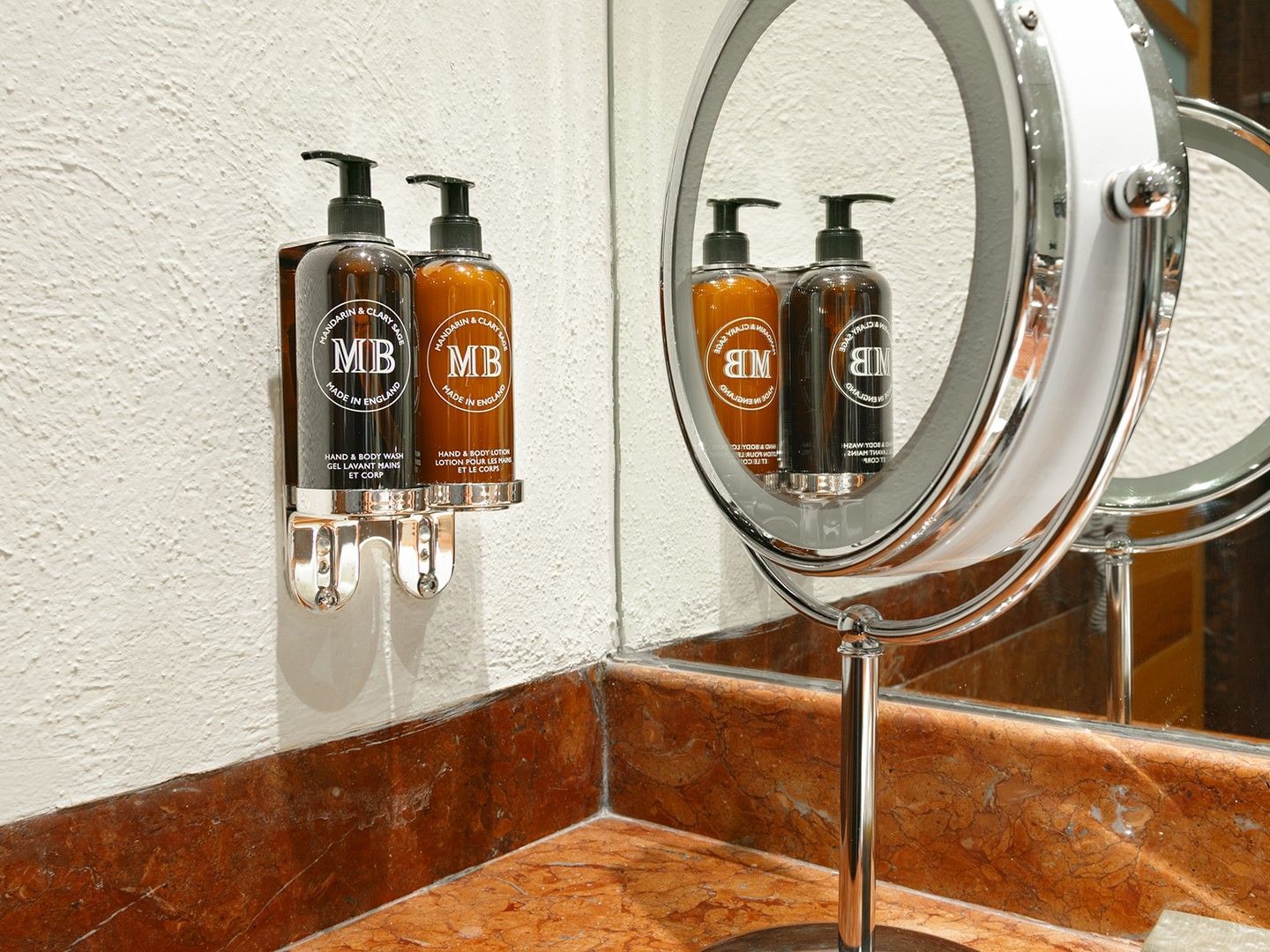 Bathroom sink with MB toiletries and a makeup mirror at Camino Real Polanco Mexico in Ciudad de Mexico.