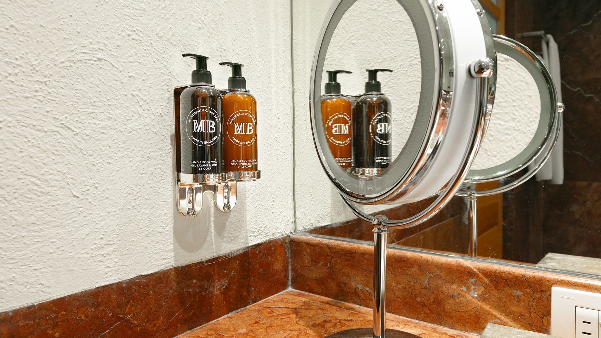 Bathroom sink with MB toiletries and a makeup mirror at Camino Real Polanco Mexico in Ciudad de Mexico.