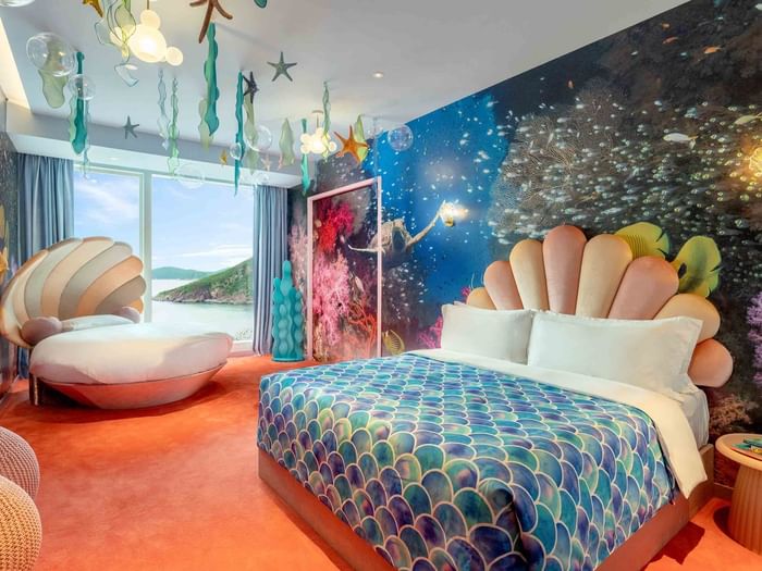Comfy bed and lounge in Mermaid Princess Room at Fullerton Ocean Park Hotel Hong Kong