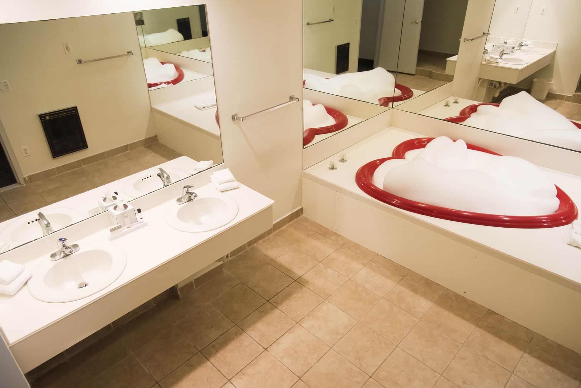 Heart shaped bath tub with sinks at Cove Haven Resort