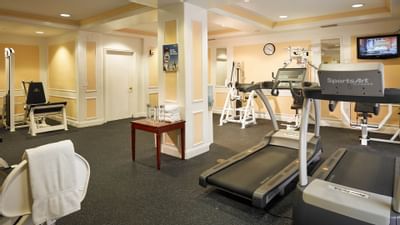 gym with treadmills and equipment
