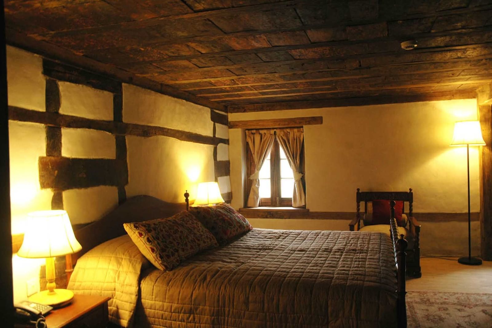 Interior of a bedroom in a hotel room at Serena Khaplu Palace