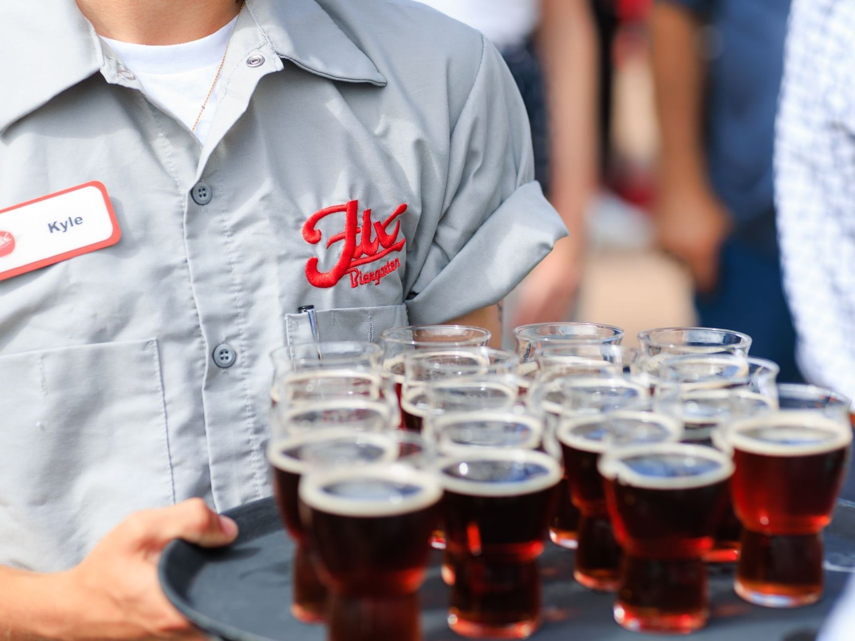 A guy holding a tray of beer at Catalina Island Company
