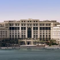 Exterior view of hotel by a river at Palazzo Versace Dubai