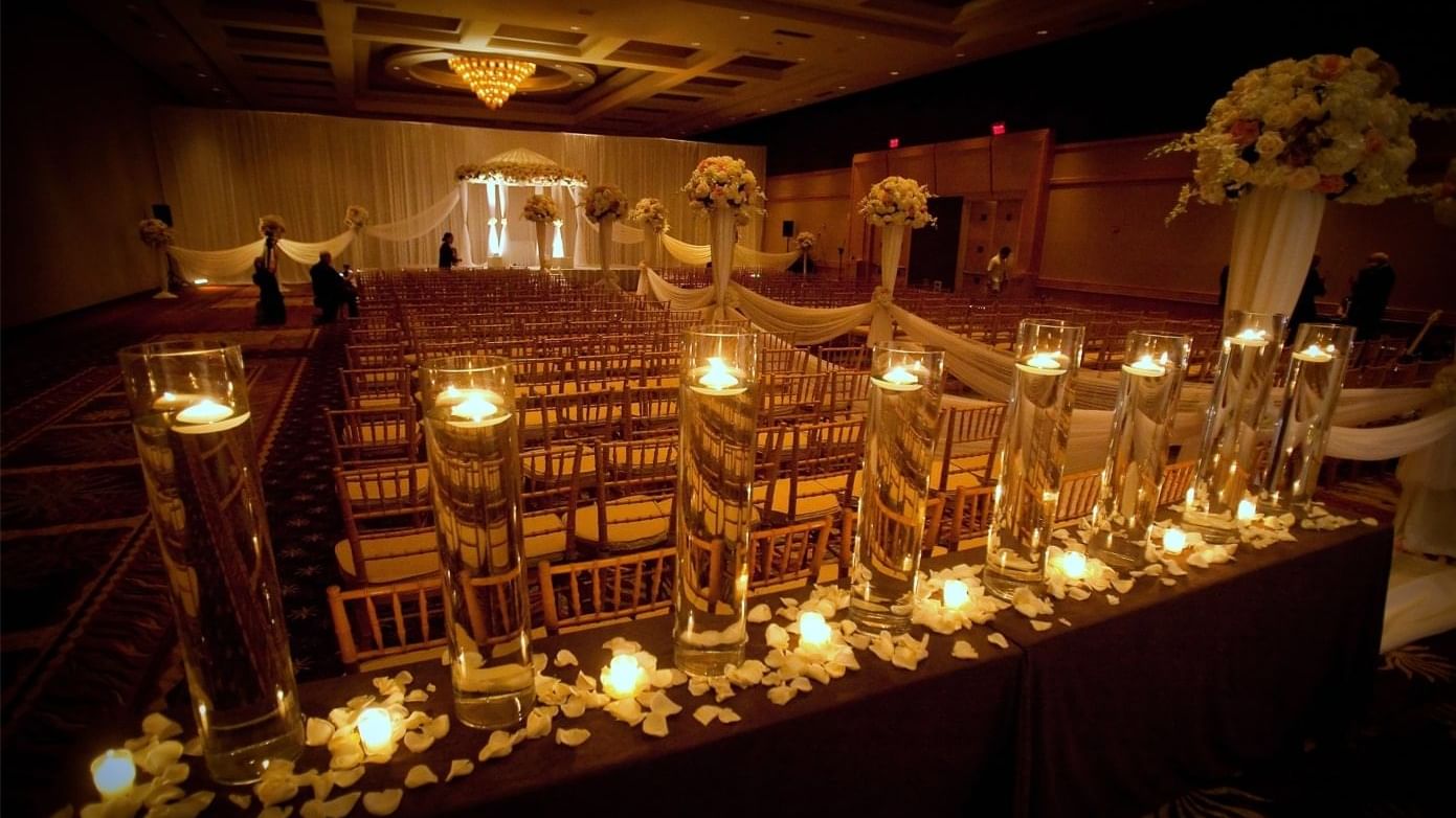 Wedding ceremony adorned with candles and flowers at The Diplomat Resort