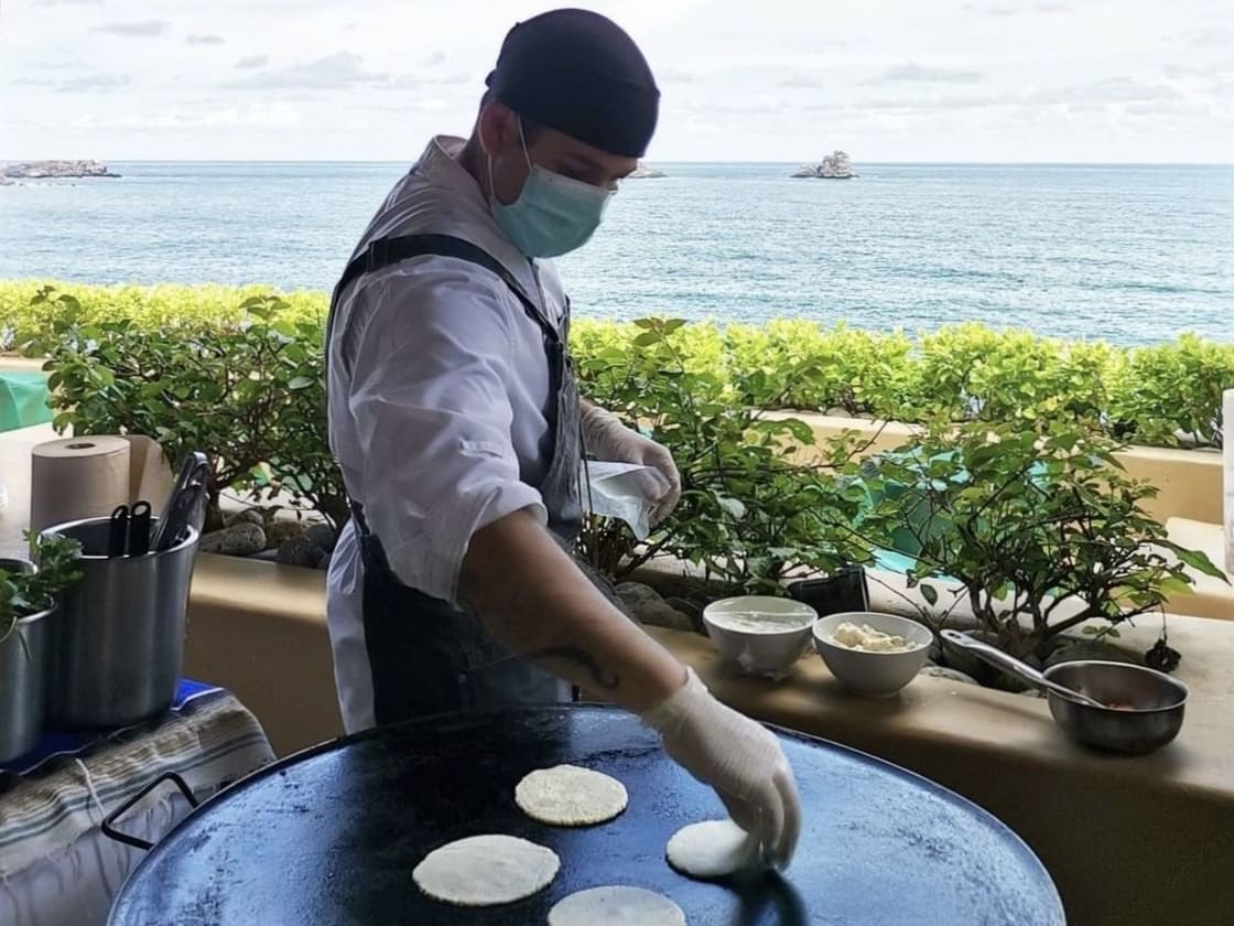 Chef making tortillas in open space at Cala de Mar Resort