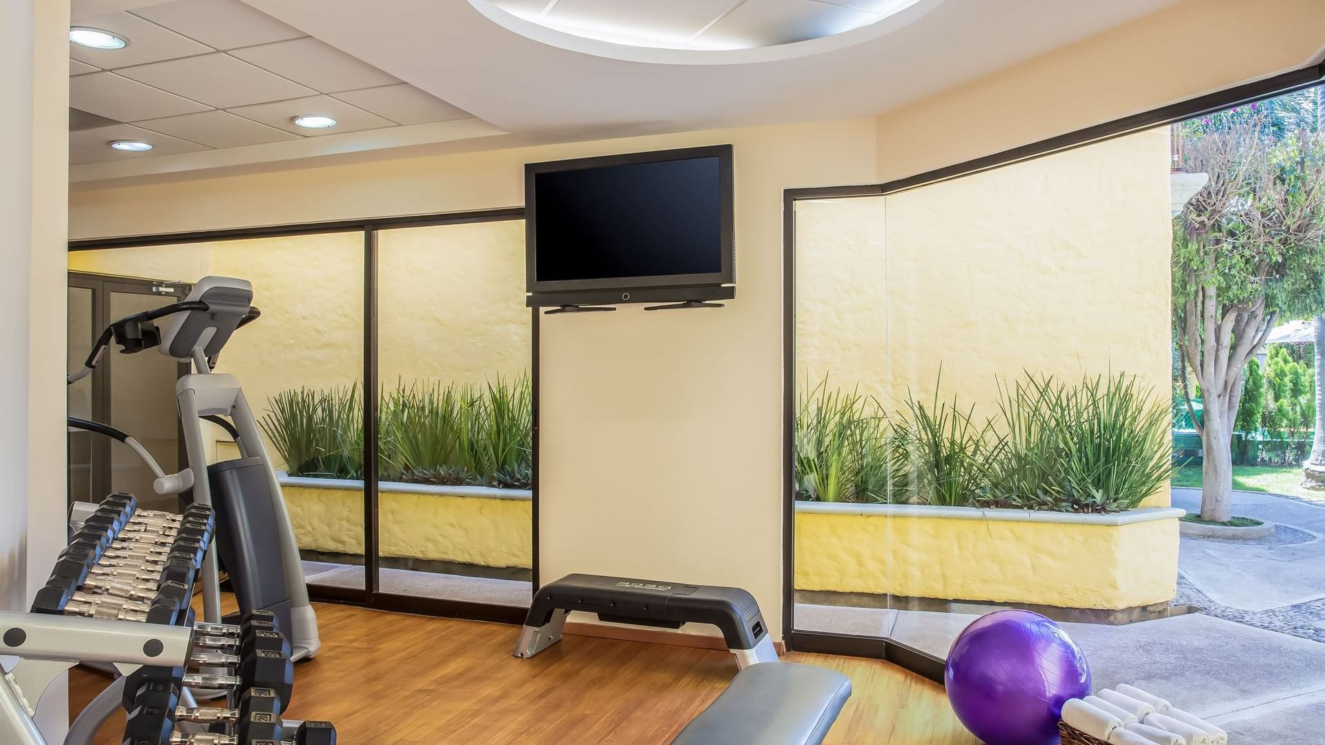 Interior of fitness center with machines at Fiesta Inn Oaxaca