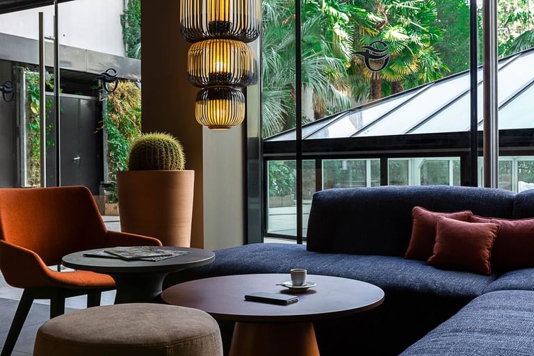 Interior of a cozy lobby with sofas & chairs at Oceania Hotels