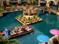 A boat sailing in the Rivercenter mall near Riverwalk Plaza