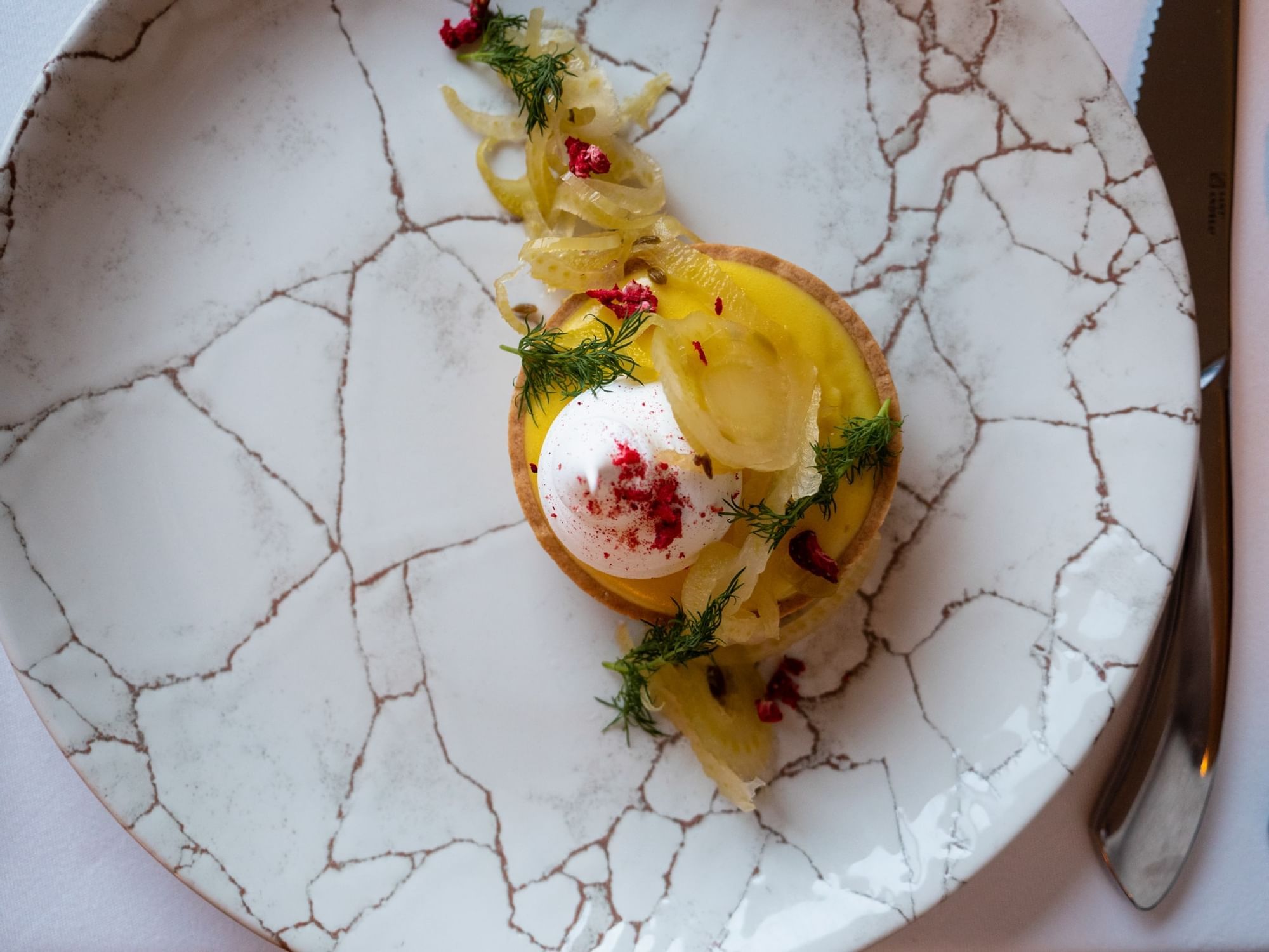 Close-up of a Goats cheese mousse plate served at Malcolm Hotel