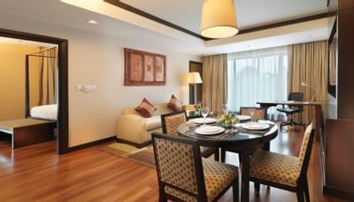 Living area with dining table in One Bedroom Premier Suite at MiCasa All Suite Hotel KL