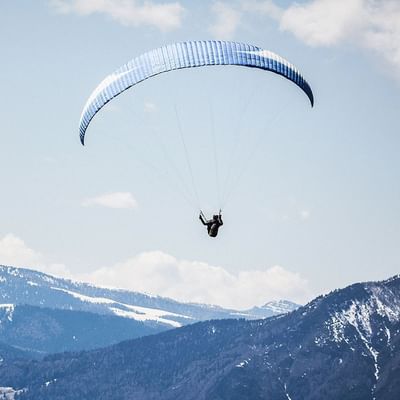 A man skydiving near Falkensteiner Hotels