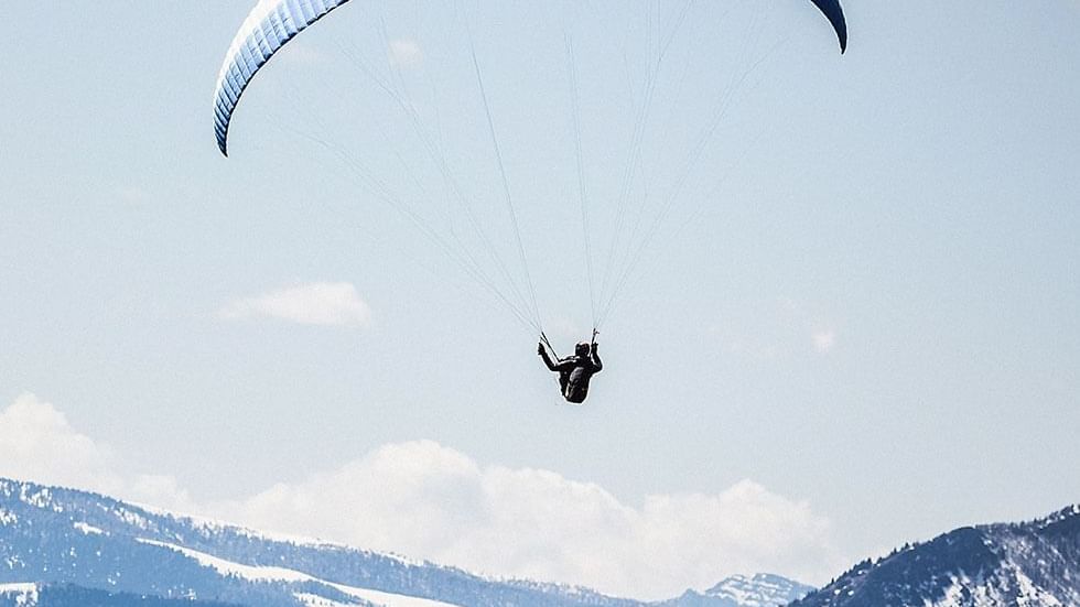 A paraglider while Paragliding near Falkensteiner Hotels