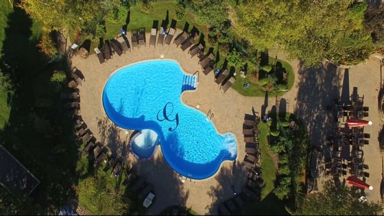 Aerial view of sunbeds by the pool at Hotel Mont Gabriel Resort