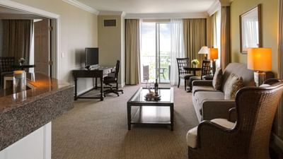 hotel suite with couch and tv