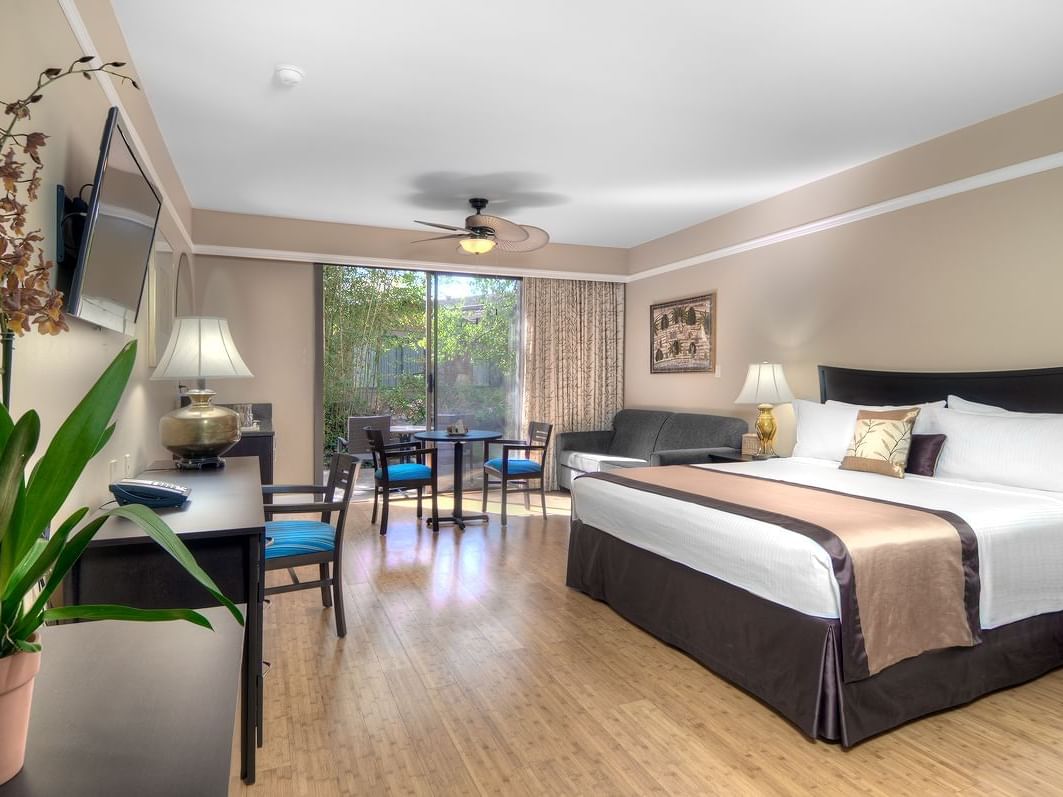 bed on wooden floor with furniture