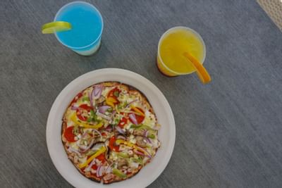 pizza and seasonal drink at Plaza Pelicanos Grand Beach Resort