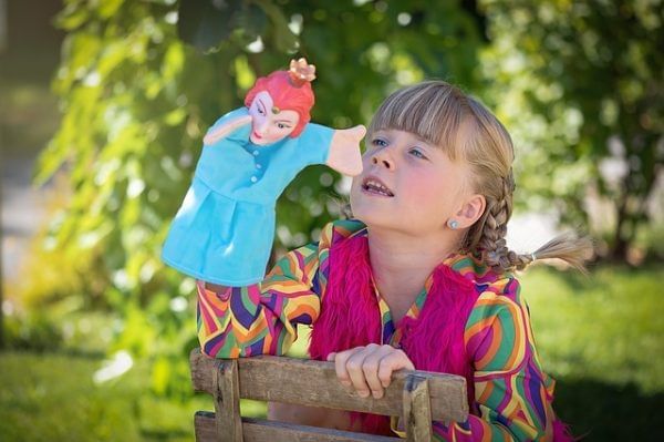 Child playing with a toy outdoors at Lake Buena Vista Resort Village & Spa