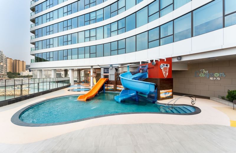 An outdoor kid's pool with slides in The Lagoon at Fullerton Ocean Park Hotel Hong Kong