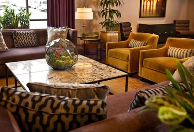 Lounge area with comfy sofas & plant pots at Paramount Hotel Seattle