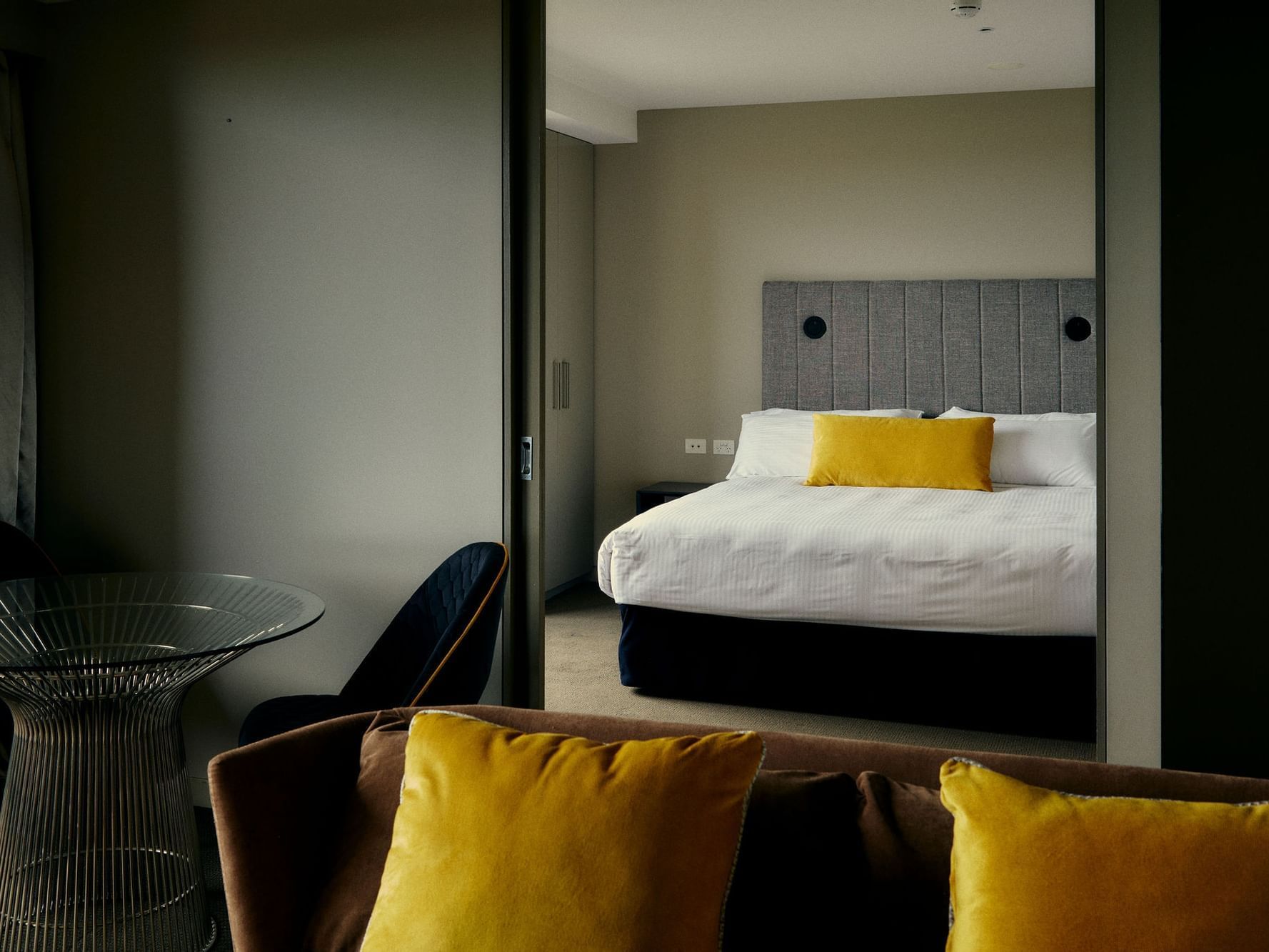 View of bedroom as from living room in a Suite at The Kinson