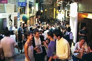 A bustling street filled with people near Park Hotel Hong Kong