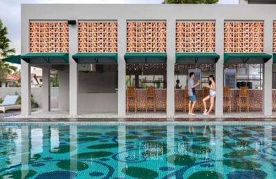 Couple standing by the bar counter in Salt Restaurant & Bar at Eastin Ashta Resort Canggu