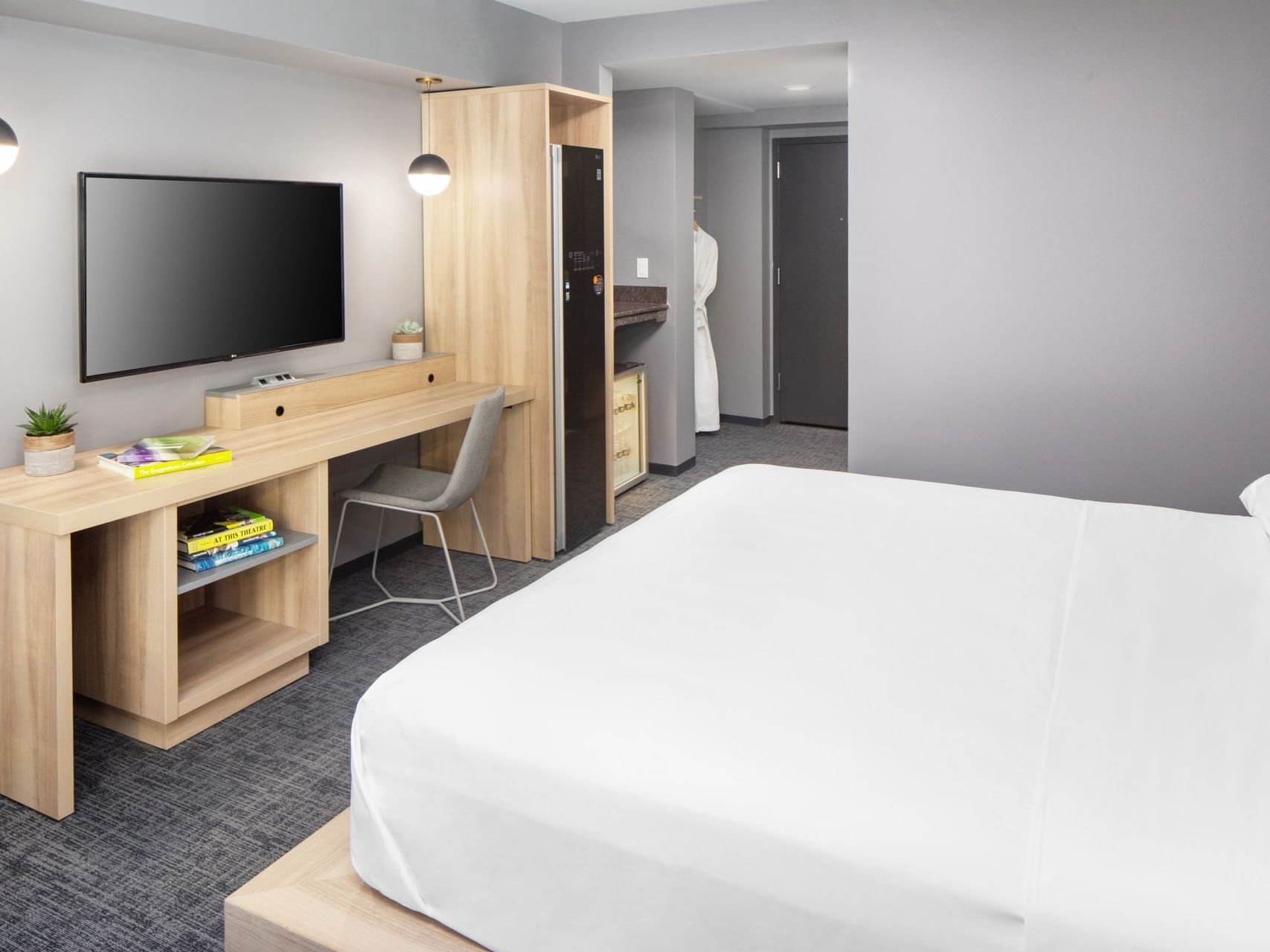 TV & work desk facing the bed in Executive King Room at Henn Na Hotel New York