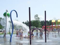 Children enjoying water activities at Kingston Park near Retro Suites Hotel