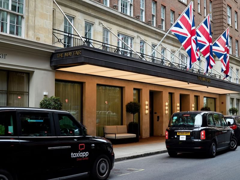 Taxis parked outside the entrance of The May Fair Hotel in London.
