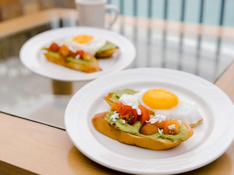 Close-up of toasts served with eggs at FA Hotels & Resorts
