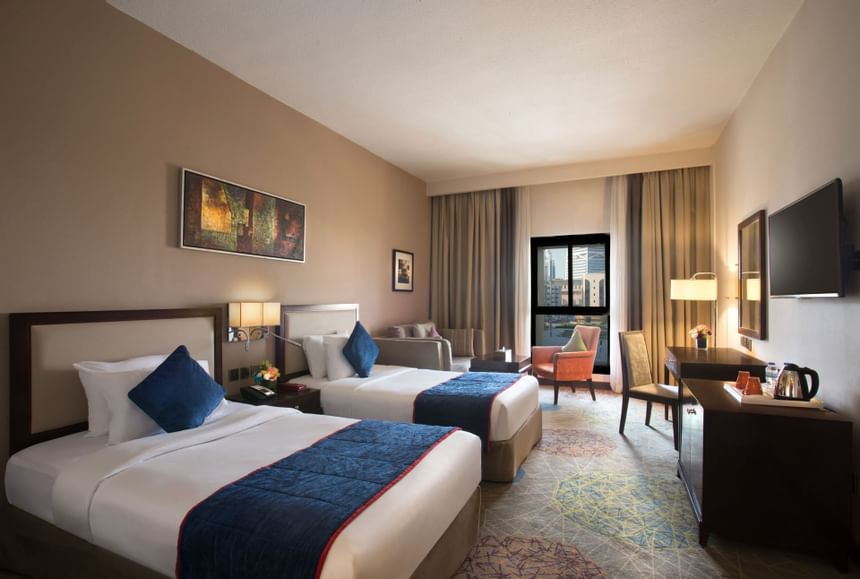 Interior of Deluxe Room with two beds at Mena Hotel Riyadh