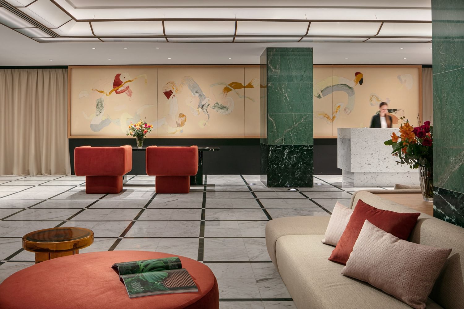 Reception desk by the lobby lounge area at Almanac X Alcron Prague