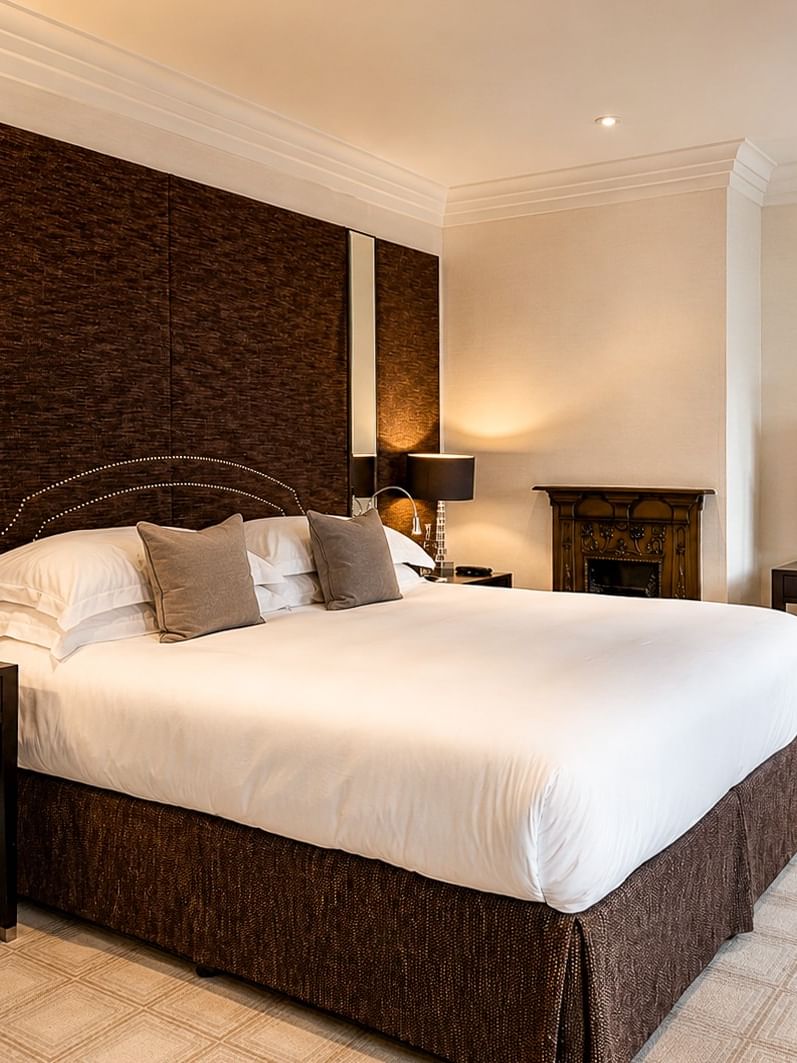 Elegant Townhouse Junior Suite bedroom at The Capital Hotel, Apartments & Townhouse - London.