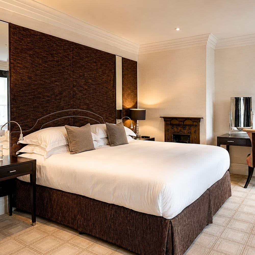 Elegant Townhouse Junior Suite bedroom at The Capital Hotel, Apartments & Townhouse - London.