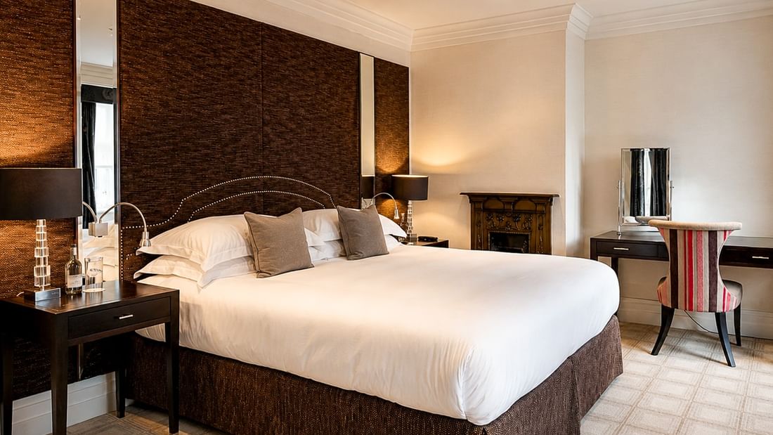 Elegant Townhouse Junior Suite bedroom at The Capital Hotel, Apartments & Townhouse - London.