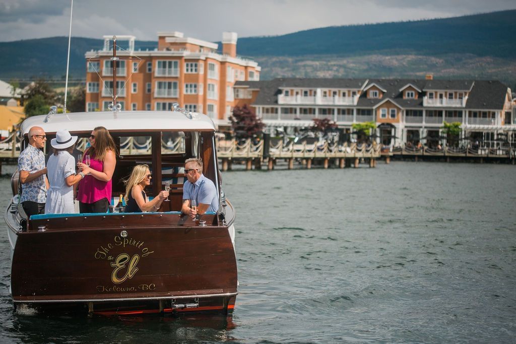 Friends on a boat on a lake.