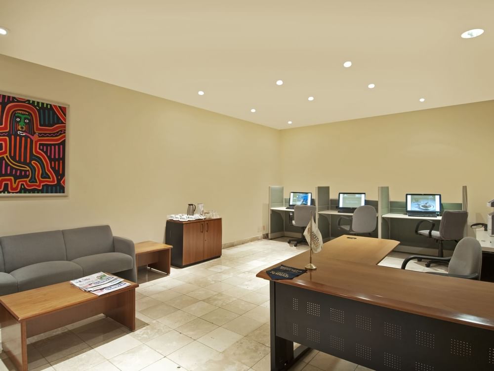 Computers & furniture in the business center at Fiesta Inn